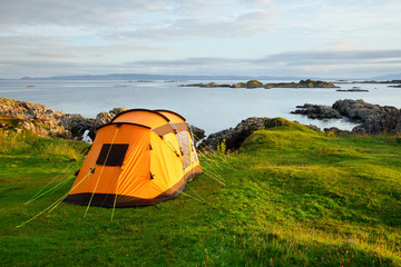 camping tent on ocean shore