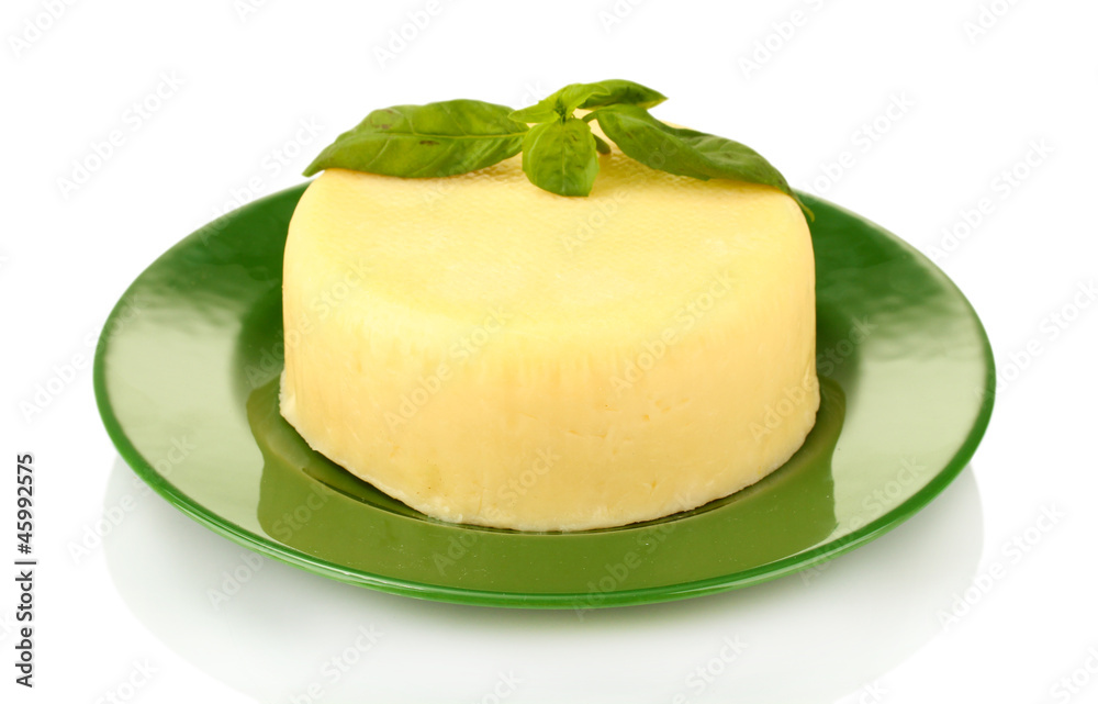 cheese mozzarella with green basil in the plate isolated