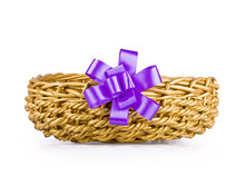 Basket For Gifts With A Lilac Bow On The White