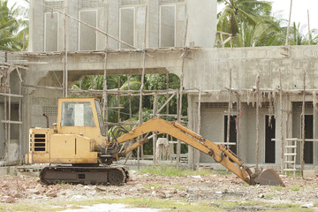 Yellow bulldozer parked on the construction site