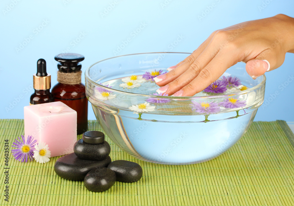 spa treatments for female hands,  on blue background
