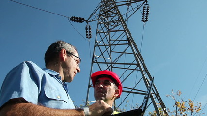 Electricians Under the High Voltage Tower