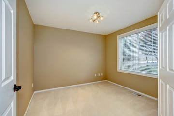 Empty new bedroom interior with brown and beige.