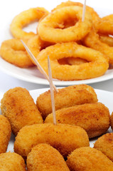 Wall Mural - spanish croquettes and calamares a la romana, breaded and fried