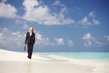 Wall Mural - business woman on the ocean coast