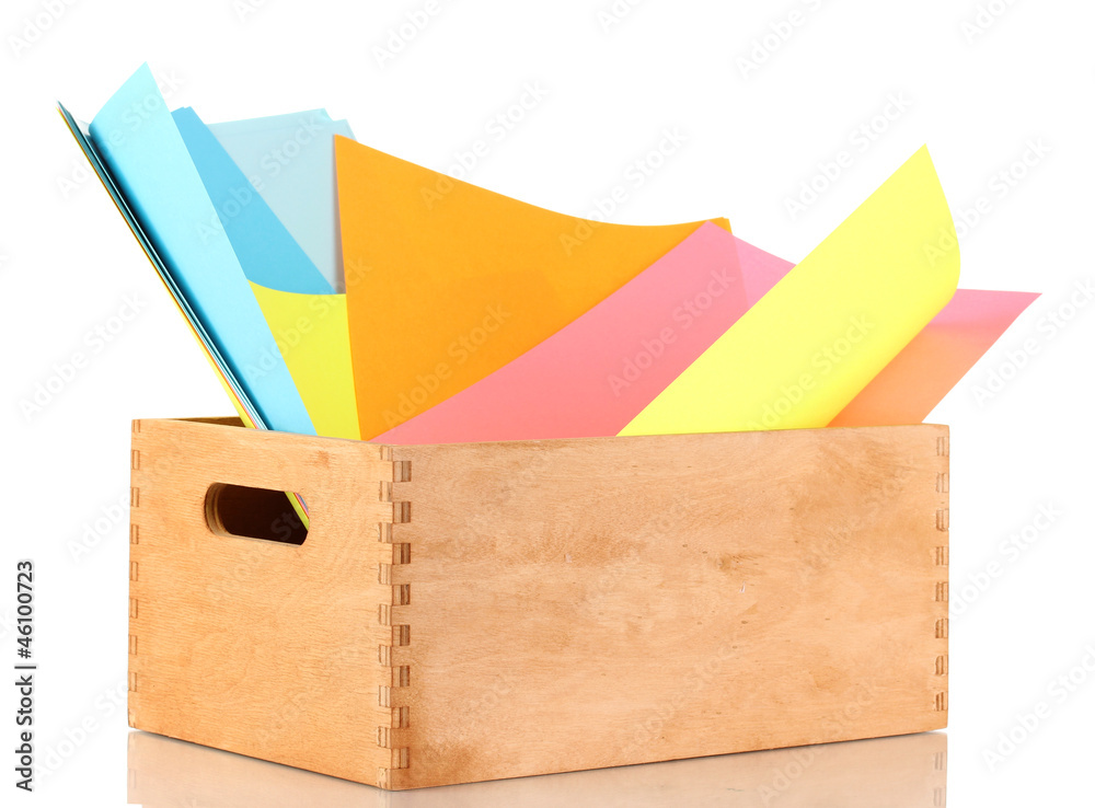 Wooden crate with colorful papers isolated on white