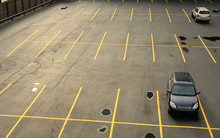 Aerial View Of A Parking Lot With Cars