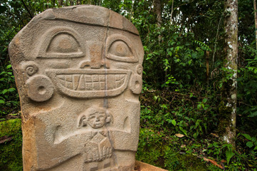 Wall Mural - A pre-columbian statue in San Agustin holding a baby.