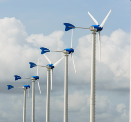 Wall Mural - white wind turbine on blue sky