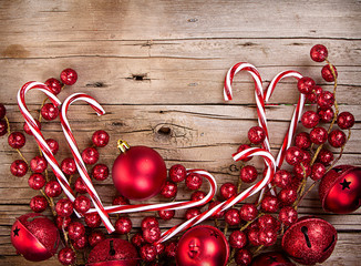 Wall Mural - Candy canes and ornaments on wood