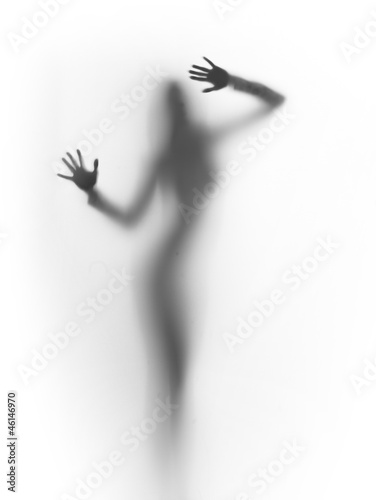 Naklejka na kafelki diffuse silhouette of a slim lady, behind a glass surface