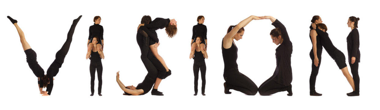 Black dressed people forming VISION word over white