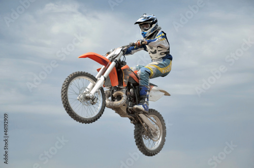 Fototapeta na wymiar MX spectacular control of the motorcycle in flight