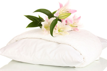 Poster - beautiful lily on pillow with towel isolated on white