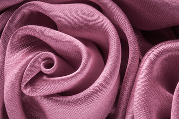 Close up of shiny light purple fabric flower.