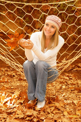 Wall Mural - Beautiful woman swinging in hammock