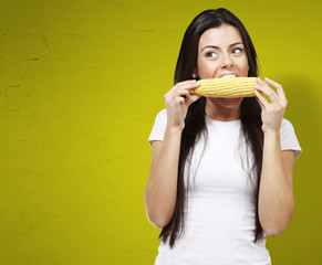 Wall Mural - woman eating a corncob