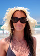 © Nick Stubbs - Sexy young female on beach with hat