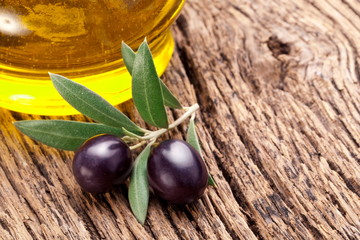 Ripe black olives with leaves.