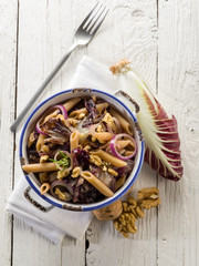 Wall Mural - pasta with chicory and nuts, vegetarian food