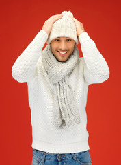 handsome man in warm sweater, hat and scarf