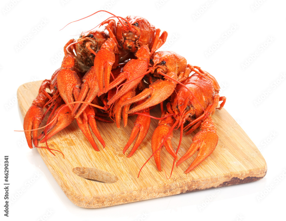 Tasty boiled crayfishes on chopping board isolated on white