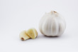 Garlic bulb and sectioned clove on white with clipping path