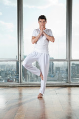 young man practicing yoga