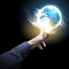 Wall Mural - hand touching the earth