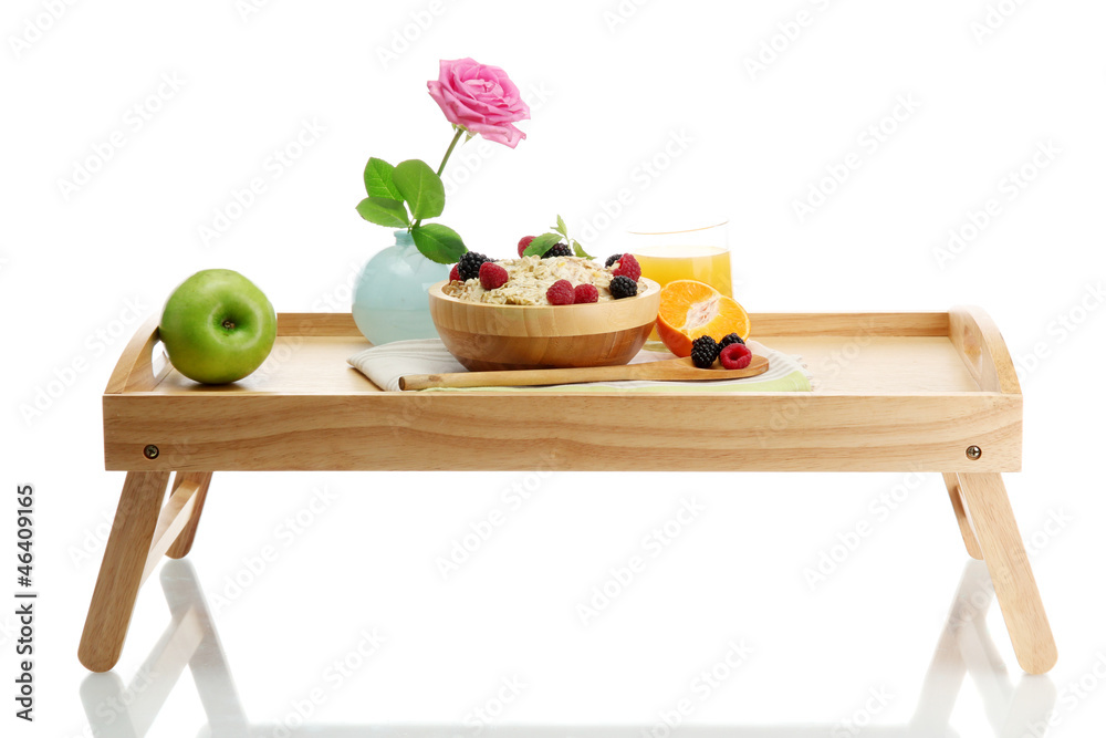 light breakfast on wooden tray isolated on white