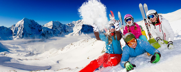 Fototapete - Ski, snow, sun and winter fun - happy family ski team