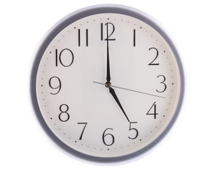 isolated white clock at five