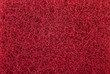 Red abrasive sponge texture background