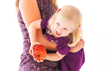 mother and daughter withl apple