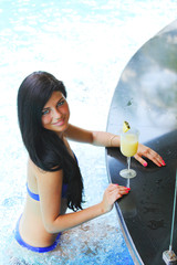 Poster - Woman with cocktail in swimming pool