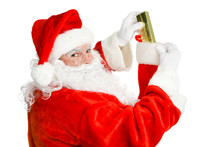 Santa Claus Stuffs A Christmas Stocking