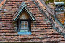Old Brick Roof With Window And A Chimney
