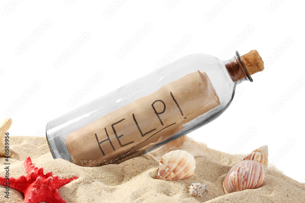 Glass bottle with note inside on sand isolated on white