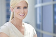 © spotmatikphoto - Blond Woman or Businesswoman With Blue Eyes