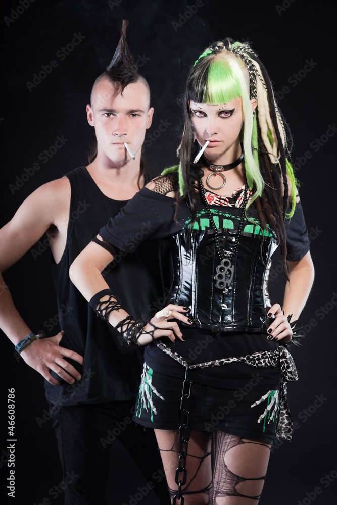 Couple of cyber punk girl and punk rock man with mohawk. の Stock 