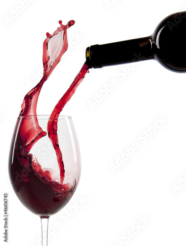 Fototapeta na wymiar Pouring red wine in a glass