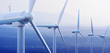 canvas print picture - Wind Turbines with distant mountains