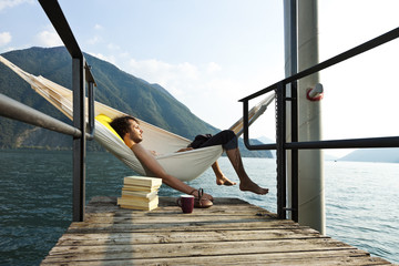 portrait of young man on the dock of Lake