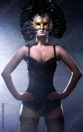 A young and sexy woman in erotic clothes and a Venetain mask - 46672625
