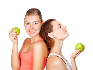 two young beautiful women with an apples