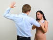 © M-Production - Man slapping a woman depicting domestic violence