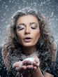 Portrait of young woman with snow make-up. Christmas snow queen