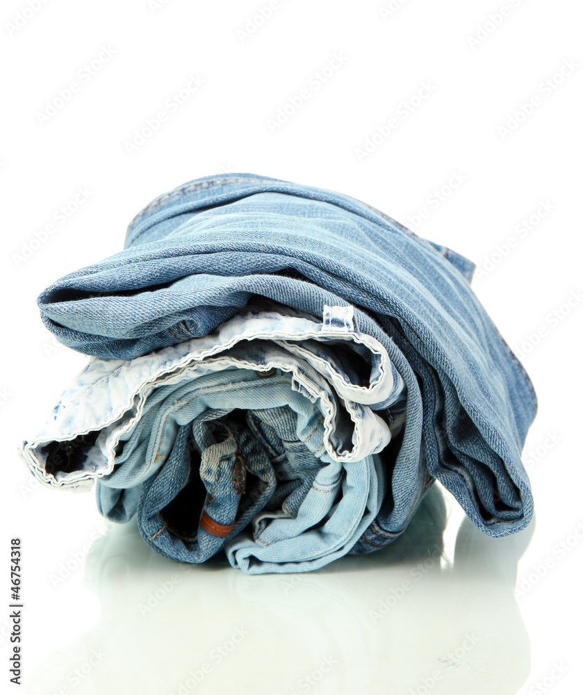 Lot of different blue jeans isolated on white