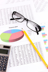 Canvas Print - Documents, calculator and glasses close-up.