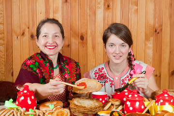 Wall Mural - Women  eating pancake with caviare